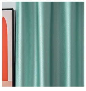 Detail showing the green curtain fabric texture with a subtle checkered pattern and drape