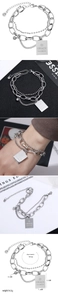 Detailed layered stainless steel chain bracelet with a square engraved charm on a white background