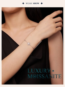 Close-up of a luxury moissanite bracelet on a female wrist showing silver plating shine