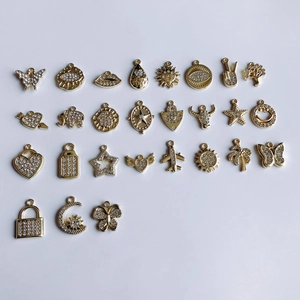 Detailed collection of gold alloy pendants with sparkling rhinestones in various shapes
