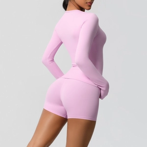 Detail of high-waist yoga shorts and brushed long-sleeve top in soft pink mauve