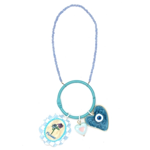 Detailed view of beaded keychain with evil eye heart pendant and shell flower charm