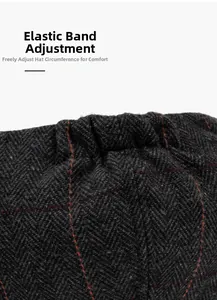 Detail of herringbone wool newsboy cap showing the elastic band for size adjustment