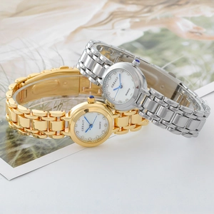 Close-up of square quartz watches with blue hands, crystal markers and steel bands