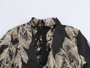 Detail of elegant V-neckline with zipper and vintage black-gold jacquard fabric