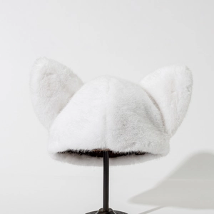 Detailed view of plush white cat ear hat crafted from soft faux fur on a display stand