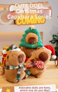 Capybara plush toys with Christmas tree hat, scarf and candy cane in a festive setting