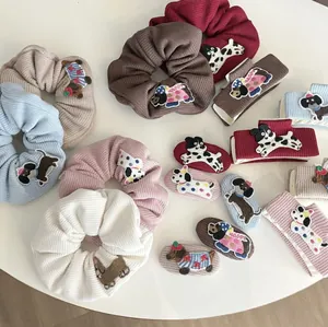 Cute embroidered dog hair accessories collection including scrunchies and hair clips