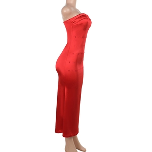 Close-up of red satin strapless dress with subtle rhinestone detailing and elegant side view