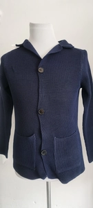 Detail of navy waffle knit cardigan showing texture, lapel collar and buttons