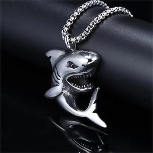 Gothic shark pendant necklace in silver stainless steel with detailed relief on black background