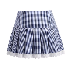 Detail of blue and white gingham pleated mini skirt with elegant white lace hem trim