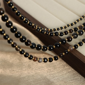 Baroque natural black agate beaded necklace with gold spacers and OT clasp closure