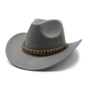 Detail of grey western cowboy hat with woven leather band and wooden beads decoration