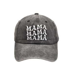Close-up of three-line MAMA embroidery on dark gray washed cotton baseball cap
