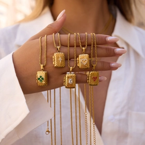 Vintage gold-plated tarot card necklaces featuring assorted symbolic charms on a chain