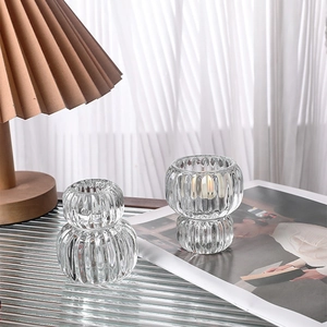 Modern minimalist ribbed clear glass double-use candle holder and decorative vase set