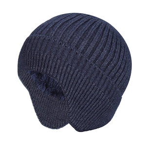 Detail of dark blue knit beanie with ear flaps and thick warm plush fleece lining