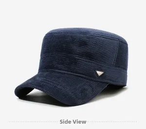 Detail view of the navy blue flat top military cap showing the textured fabric and metal logo
