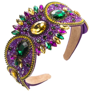 Macro detail of Baroque headband with purple emerald crystals and golden beads