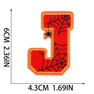 Detailed embroidery of letter J with spider web pattern and dimensions 6cm x 4.3cm