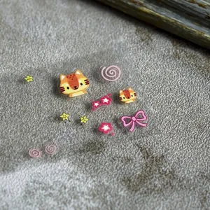 Thin flexible 5D nail art stickers featuring cat heads, stars and New Year greetings