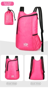 Detail of rose red foldable hiking backpack featuring breathable straps and storage pouch