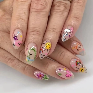 Close-up of clear press-on nails with colorful hand-painted flowers and rainbows