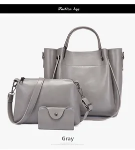 Three-piece grey fashion bag set including large tote, crossbody bag and pouch with hardware