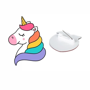 Cute acrylic unicorn brooch with rainbow mane and metal safety pin on white background