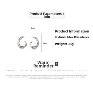 Detail view of silver C-shaped hoop earrings with rhinestones measuring 3cm x 4cm