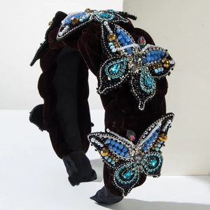 Deep burgundy velvet braided headband with ornate handcrafted beaded butterfly accents
