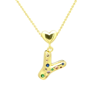 Macro shot of gold-plated heart and colorful zircon-encrusted letter Y pendant necklace