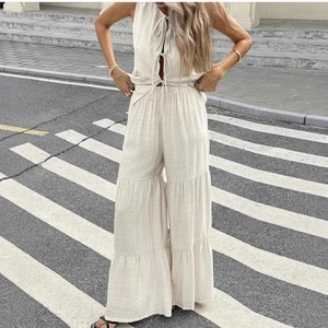 Women's cream cotton linen two-piece set with tie-up vest and tiered wide-leg trousers