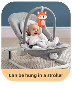 Close-up of a fox plush toy with music buttons hung in a stroller for babies