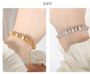 Detail view of gold and silver beaded bracelets with sparkling rhinestone spacers