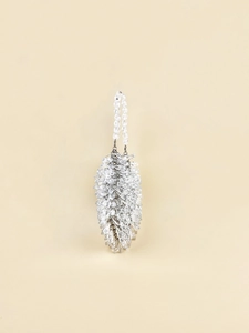 Close-up of hand-woven silver crystal beads on a stylish teardrop-shaped handbag