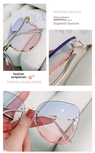Detailed close-up of gradient blue and pink lenses with golden wavy metal frame temples