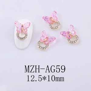 Macro detail of 12.5x10mm pink resin butterfly nail art charm on gold rhinestone base