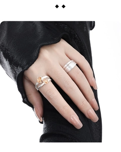 Detailed shot of double-layer S925 silver rings with orange crystal and brushed texture