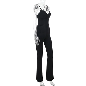 Side view of black slim-fit jumpsuit featuring delicate lace trim and flared leg design