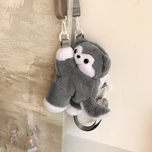 Detail of cute grey plush dog crossbody bag featuring soft fabric and adjustable strap