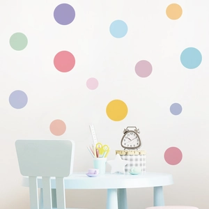 Detail showing multi-colored round polka dot wall decals in a cozy kids bedroom setting