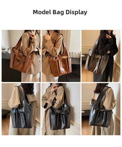 Detail of large vintage leather tote bag showing front pockets and interior capacity