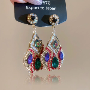 Elegant gold drop earrings with colorful crystals and green teardrop rhinestone
