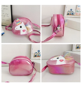 Pink unicorn crossbody bag for girls showing front side and top views on white desk