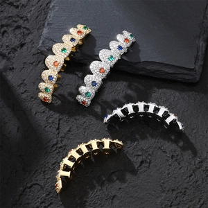 Hip hop grillz set with colorful zircons in gold and silver plating on black stone