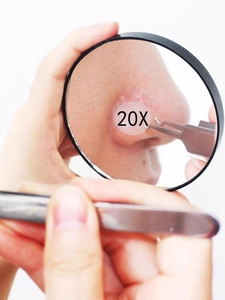 Detail view of 20X magnification mirror showing precision blackhead removal for skin care