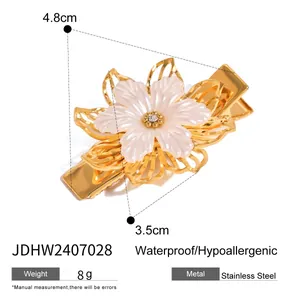 Macro view of 18k stainless steel flower hair clip with zirconia and pearl finish