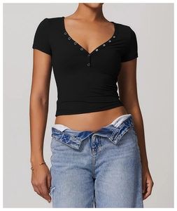 Close-up of V-neckline with metal ring buttons on breathable black yoga sports t-shirt